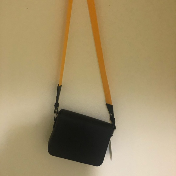 bag with yellow strap